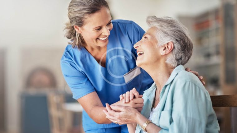 Caregiver and elderly Lady laughing